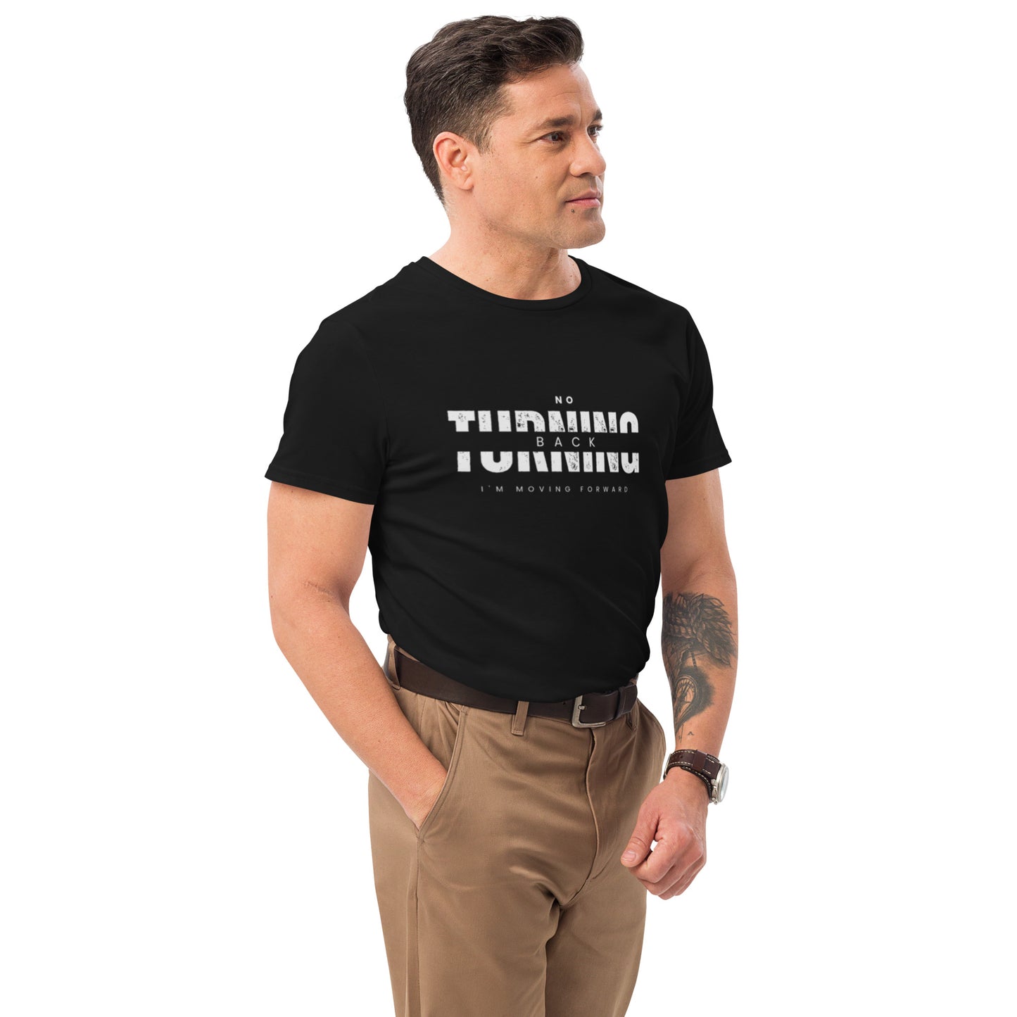Man wearing a comfortable men's fashion t-shirt with graphic text paired with brown pants