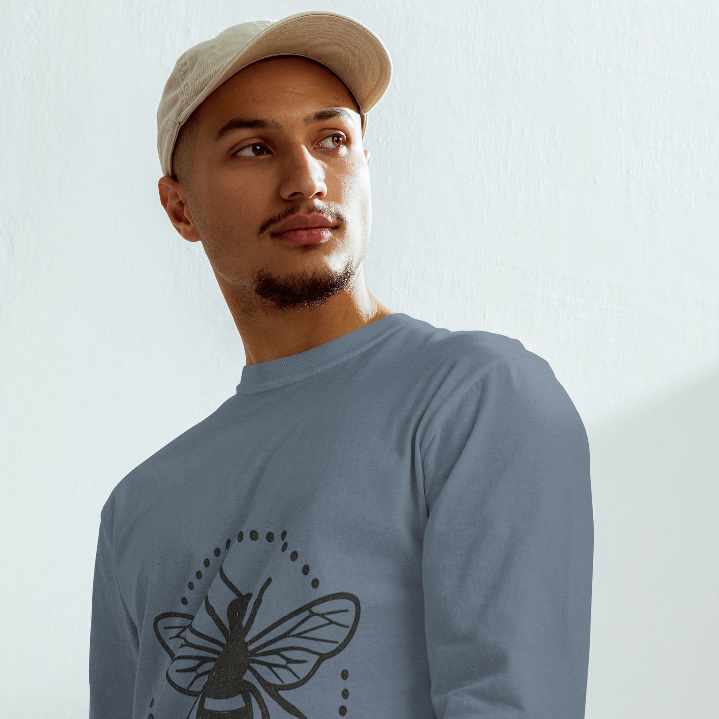 PJ Designs garment-dyed heavyweight long sleeve shirt in blue with bee graphic worn by male model