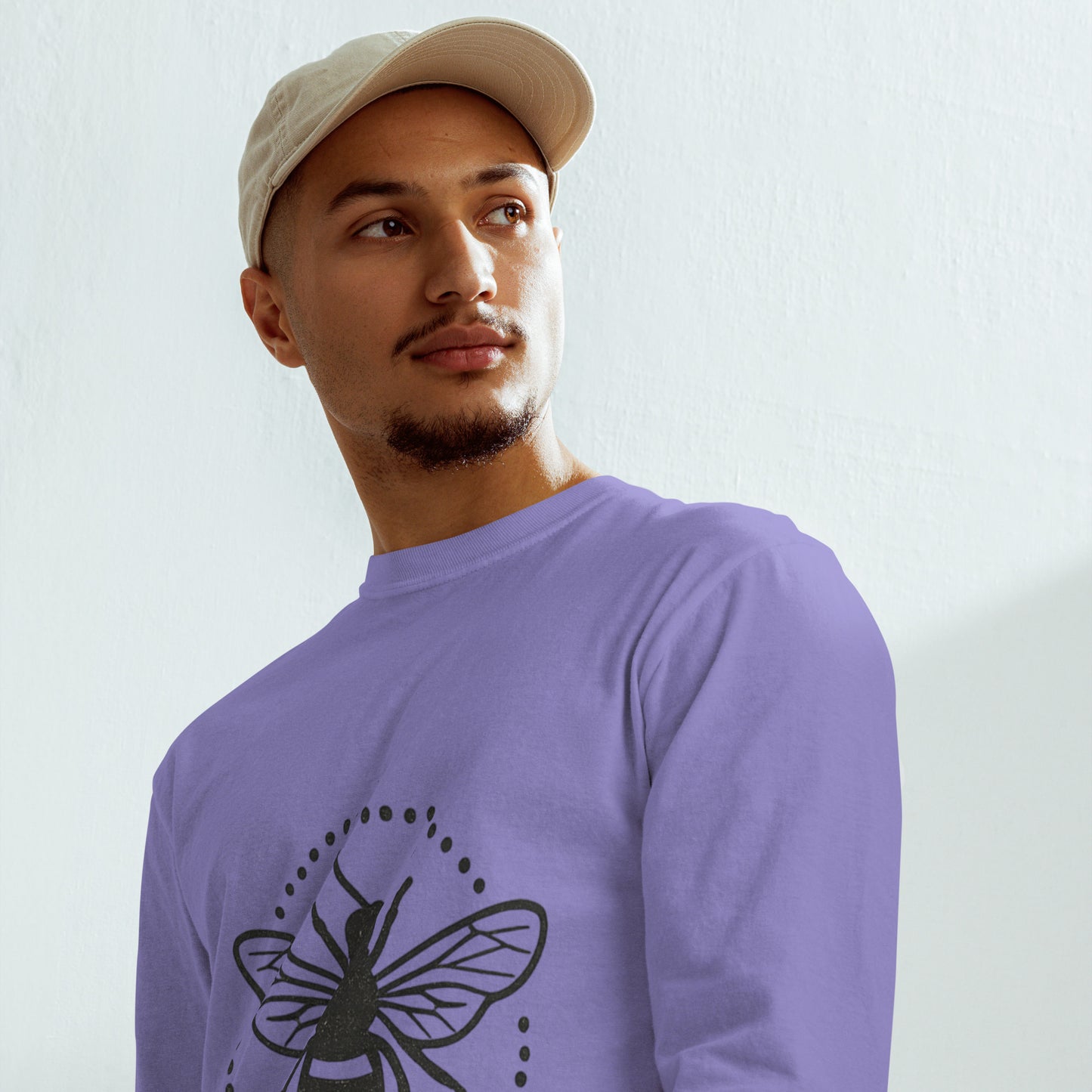 PJ Designs garment-dyed heavyweight long sleeve shirt in lavender with bee graphic worn by man with beige cap