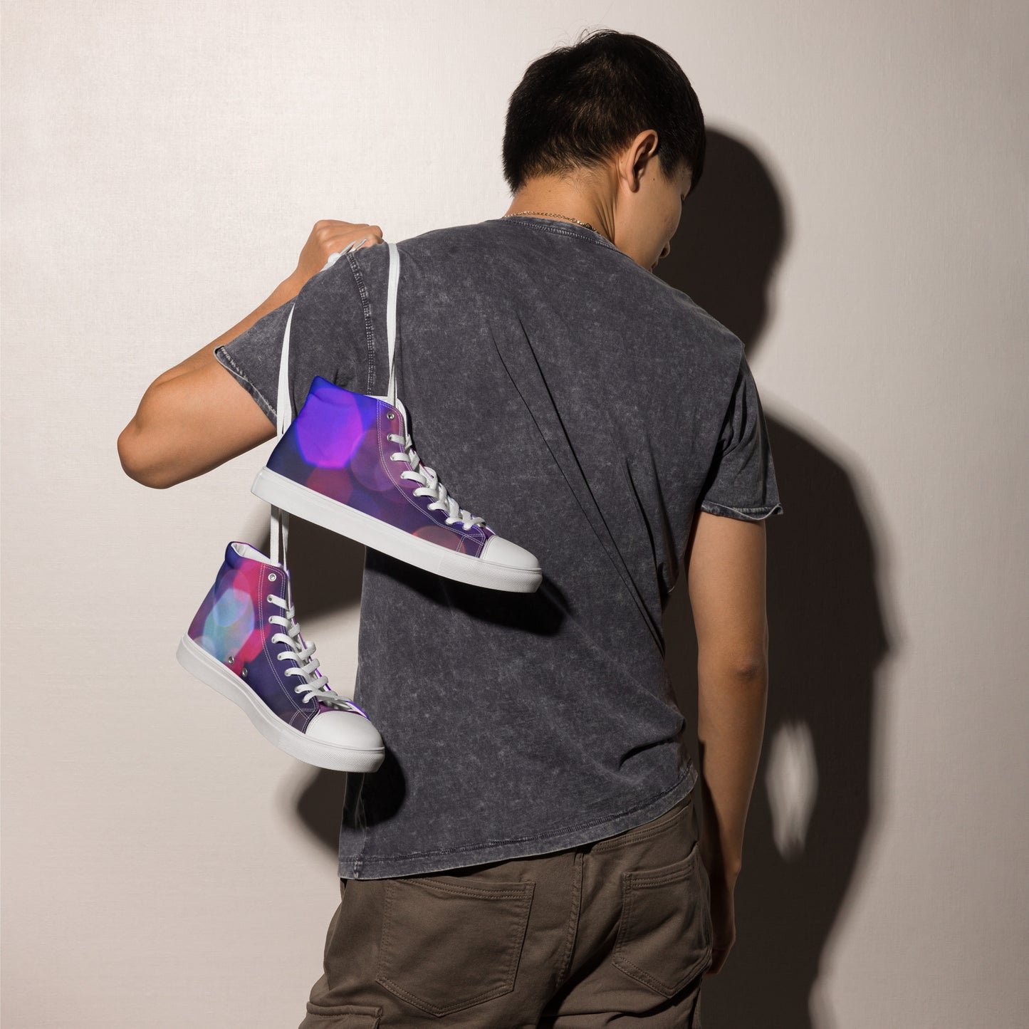 Man holding purple men's high top canvas shoes with white laces and soles by PJ Designs