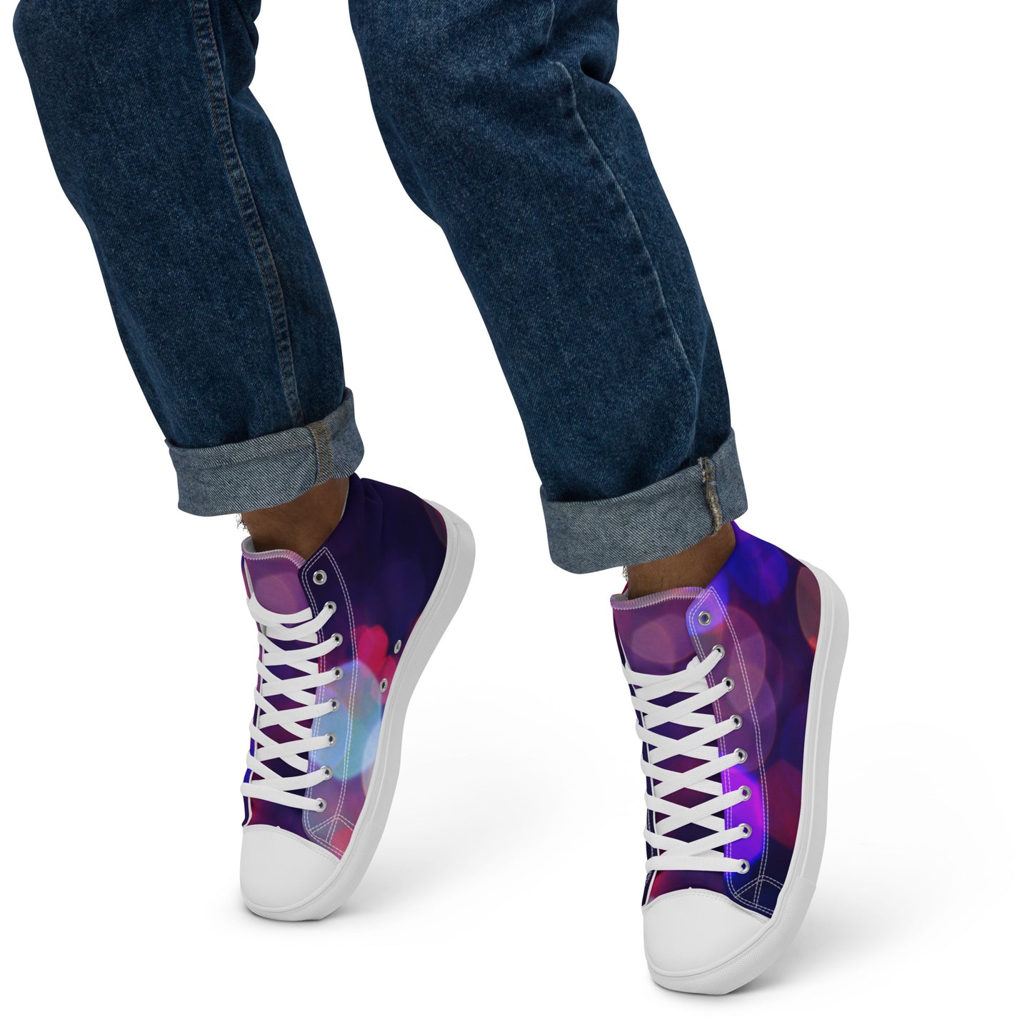 PJ Designs men's high top canvas shoes with purple and pink gradient design worn with rolled blue jeans