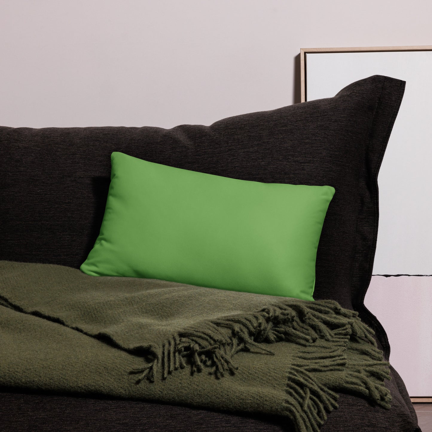 PJ Designs modern dove print cushion cover on dark sofa with olive green throw blanket