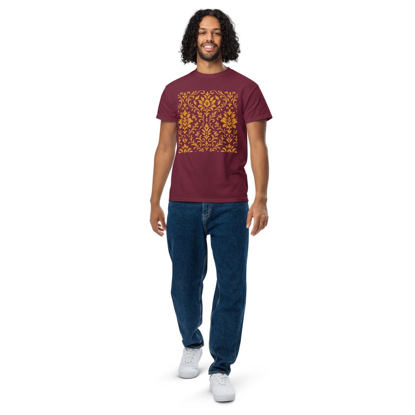 PJ Designs model wearing maroon unisex DryBlend t-shirt with gold ornate square print, casual jeans and white sneakers