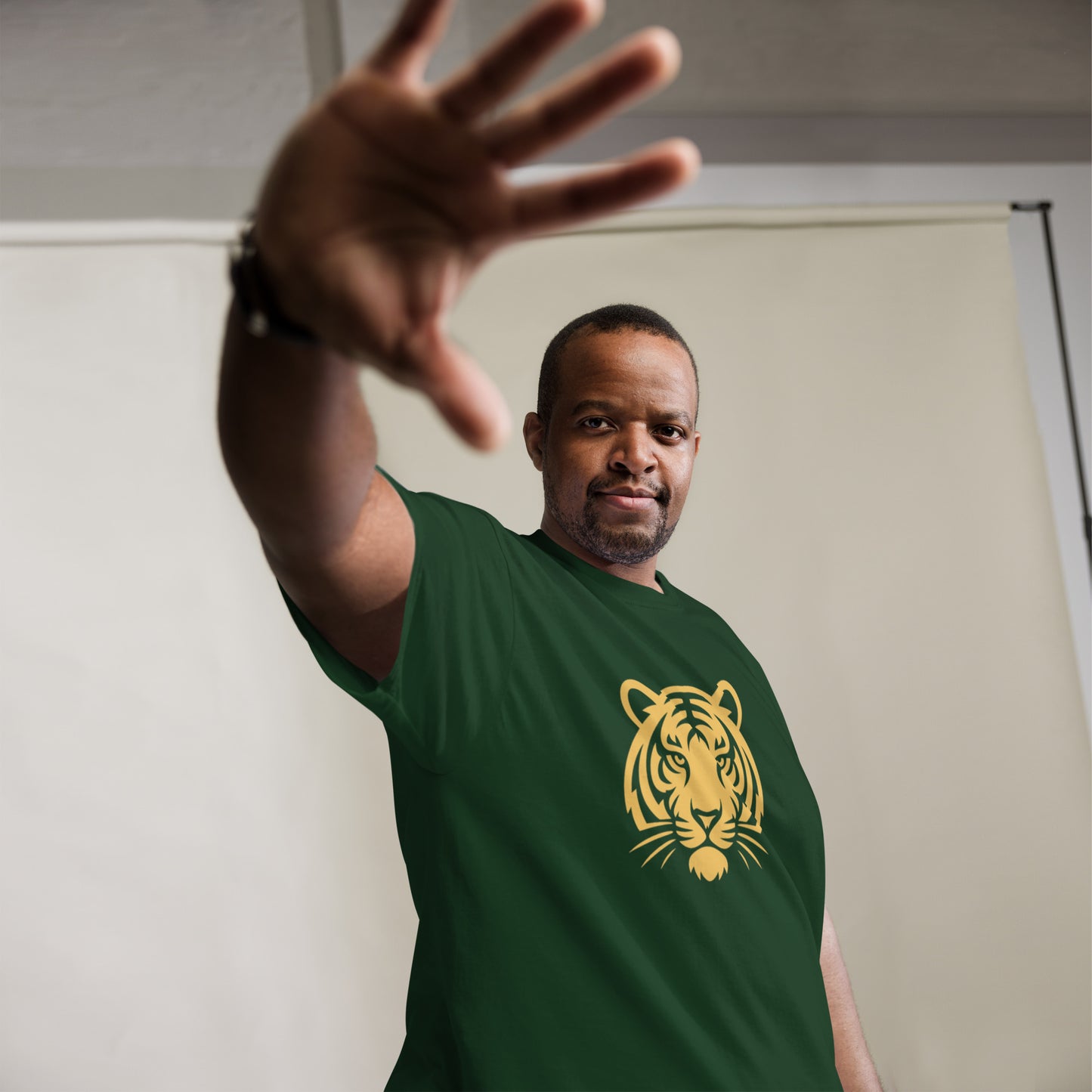 PJ Designs model wearing green tiger graphic tee for men and women with bold yellow tiger head print