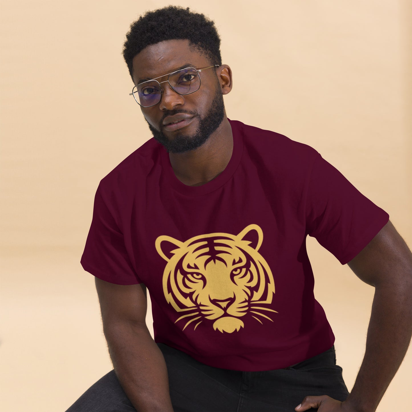 Man wearing PJ Designs maroon shirt with gold tiger face print tiger graphic tee for men and women casual