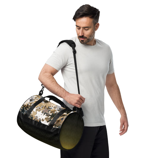 Man carrying PJ Designs all over print workout bag with star pattern and black strap