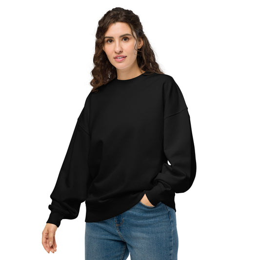 PJ Designs comfortable oversized crewneck sweatshirt in black worn by woman with casual blue jeans