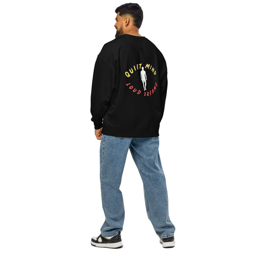 Man wearing a PJ Designs comfortable oversized crewneck sweatshirt with Quiet Mind Loud Dreams design on back
