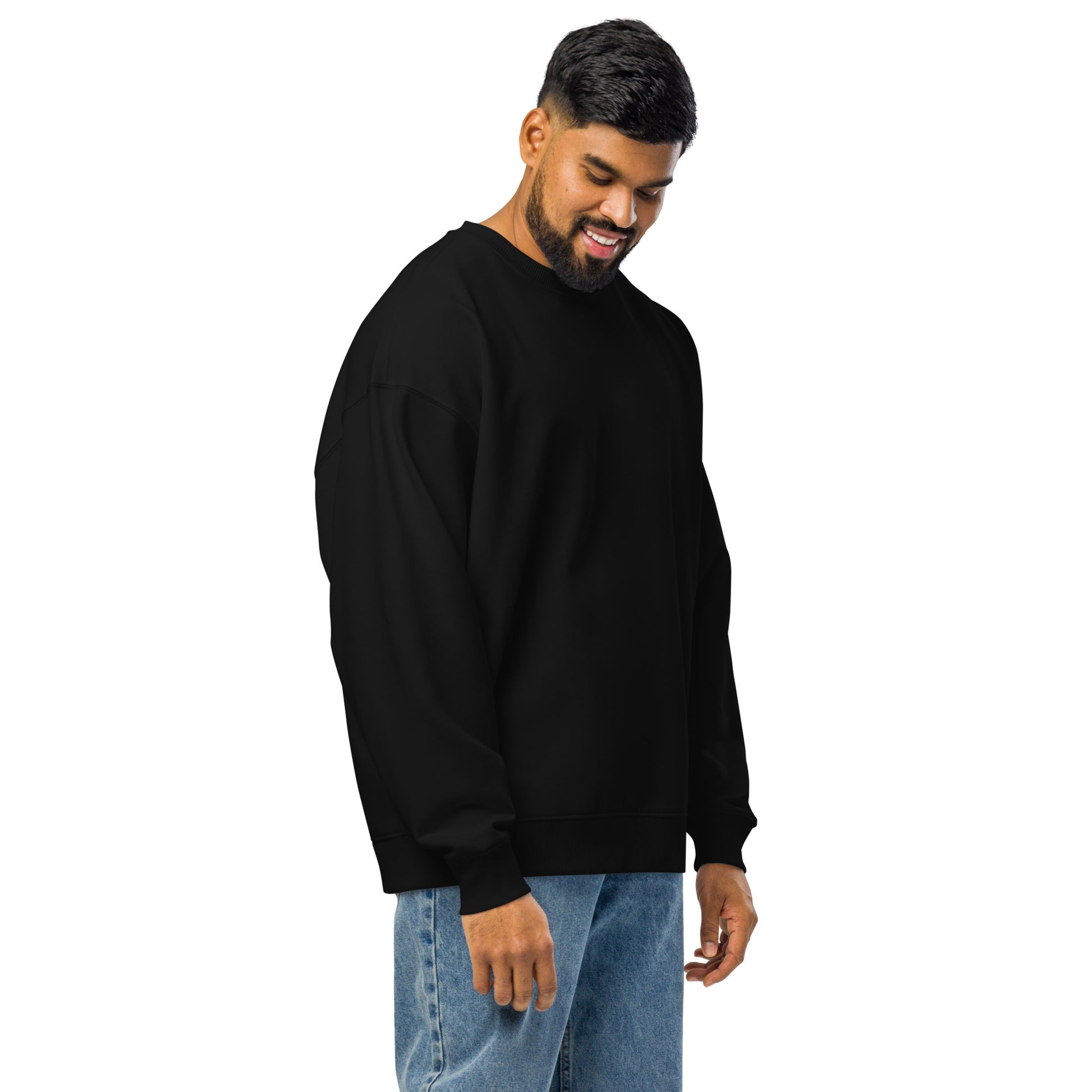PJ Designs comfortable oversized crewneck sweatshirt in black worn by man with blue jeans