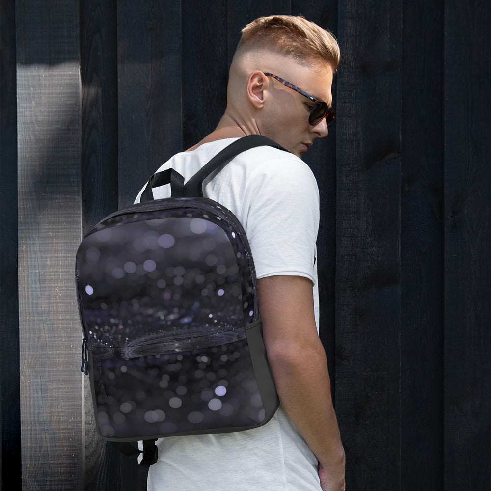 Fashionable backpack with unique design by PJ Designs worn by man in white shirt and sunglasses