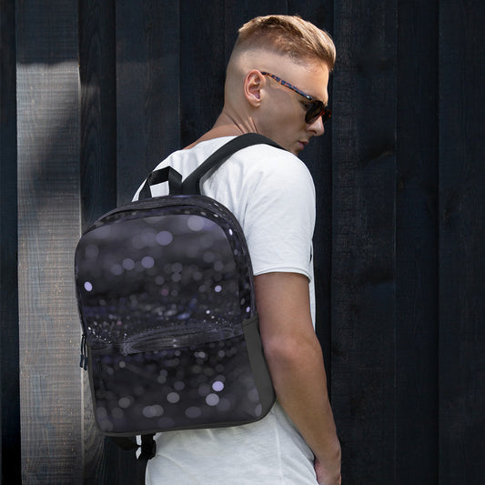 Fashionable backpack with unique design by PJ Designs worn by man in white shirt and sunglasses