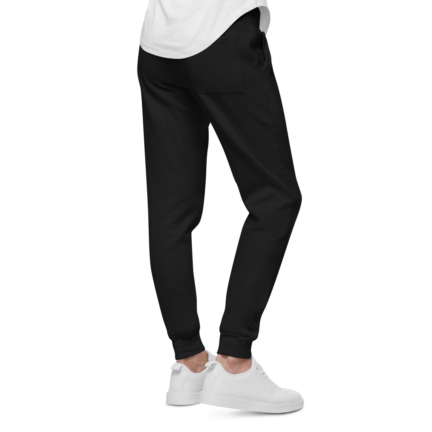 Black fleece sweatpants for men and women by PJ Designs styled with white sneakers and a white shirt