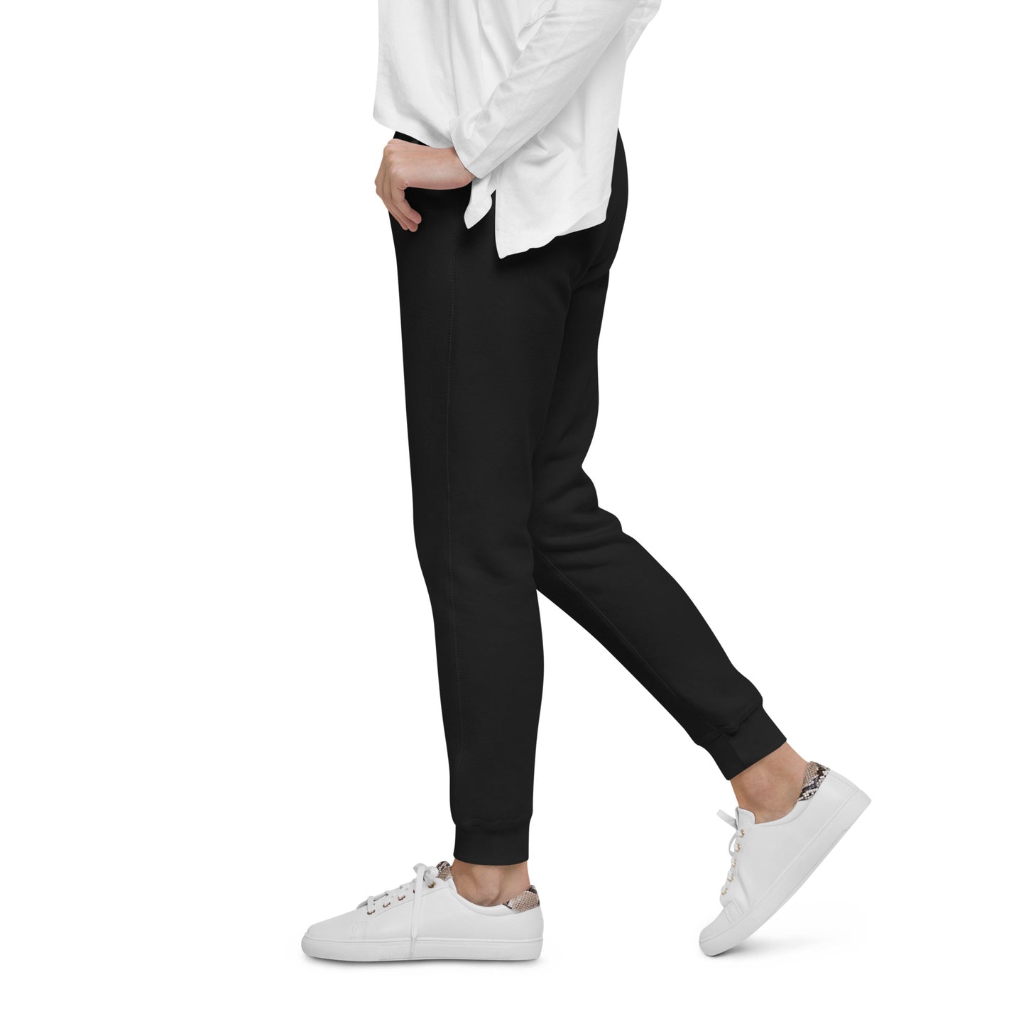 PJ Designs black fleece sweatpants for men and women worn with white sneakers and a white top
