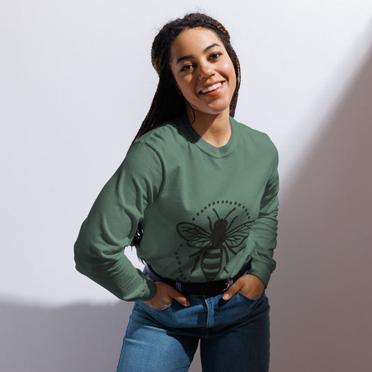PJ Designs garment-dyed heavyweight long sleeve shirt in green with bee graphic worn by smiling woman