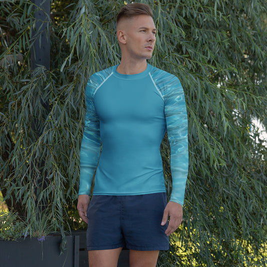 PJ Designs athletic swim top for men in blue with long sleeves modeled outdoors