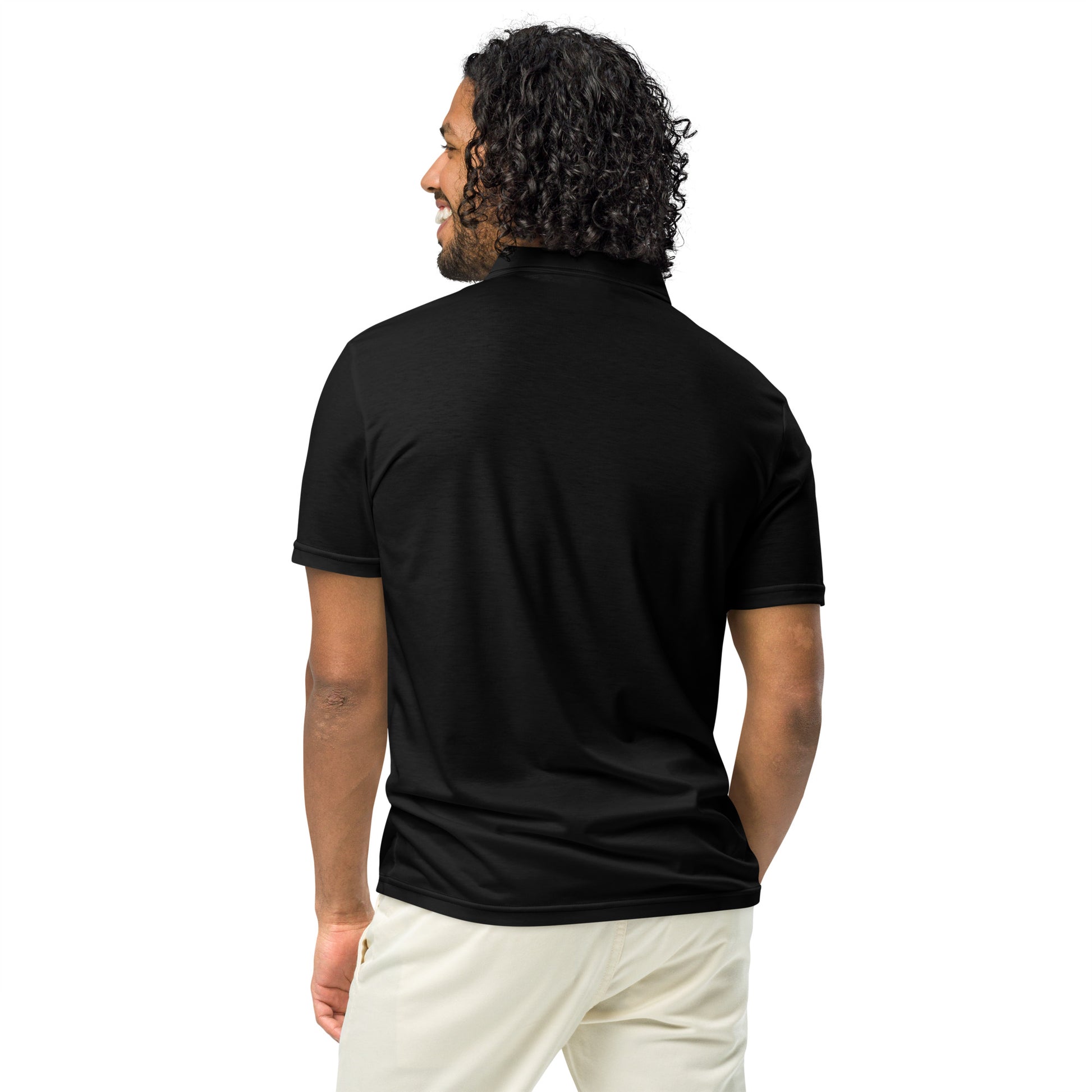 Back view of a man wearing a black men’s slim fit polo shirt by PJ Designs with short sleeves