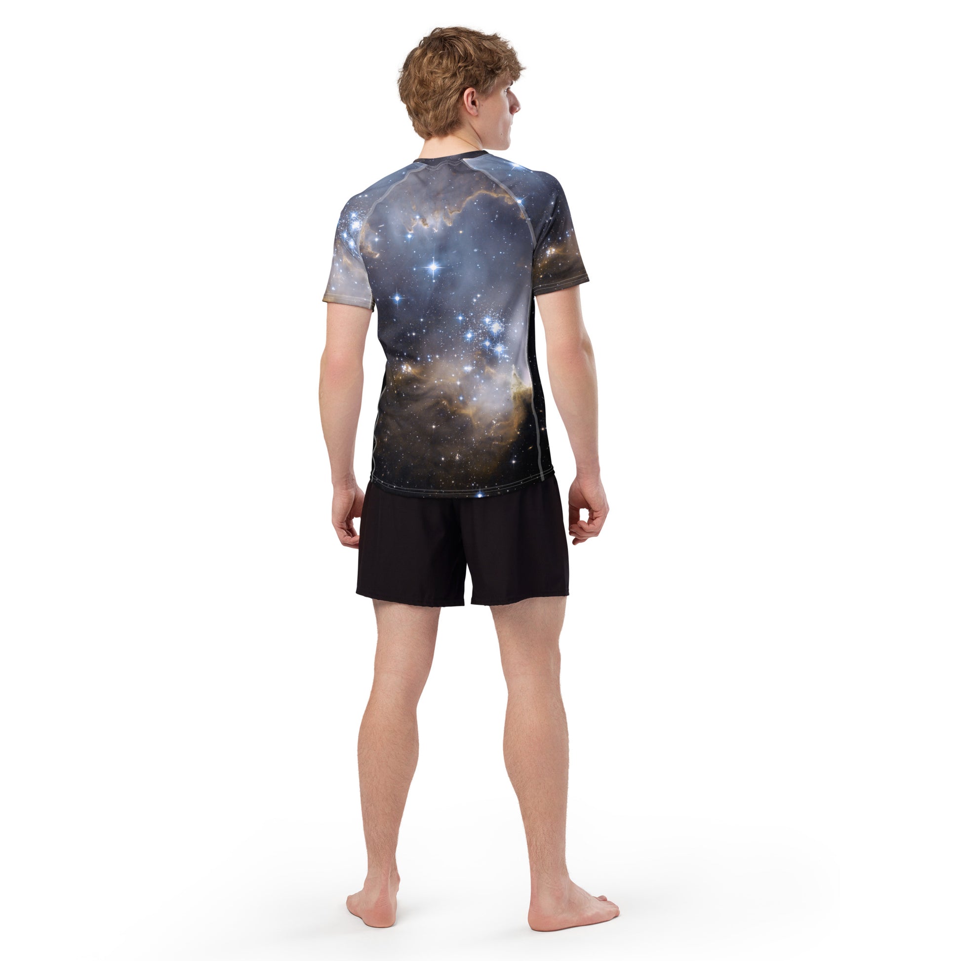 PJ Designs stylish men’s rash guard top with galaxy print worn by a man from back