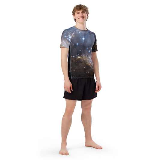 Stylish men’s rash guard top by PJ Designs with galaxy star print worn by male model