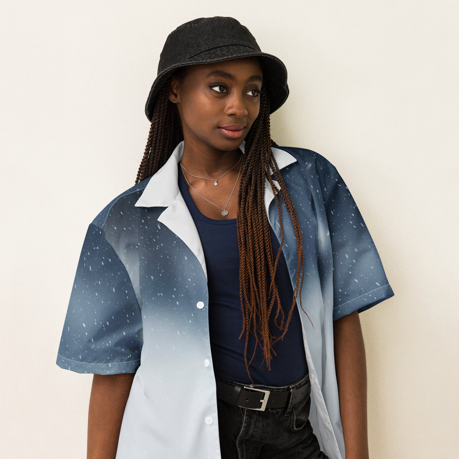 PJ Designs unisex casual button shirt in blue gradient worn with black hat and black pants
