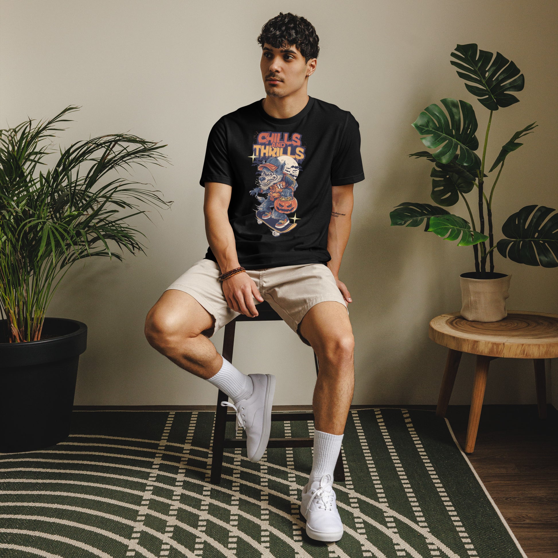 Unisex eco friendly t-shirt featuring a playful Halloween graphic design on a model sitting indoors