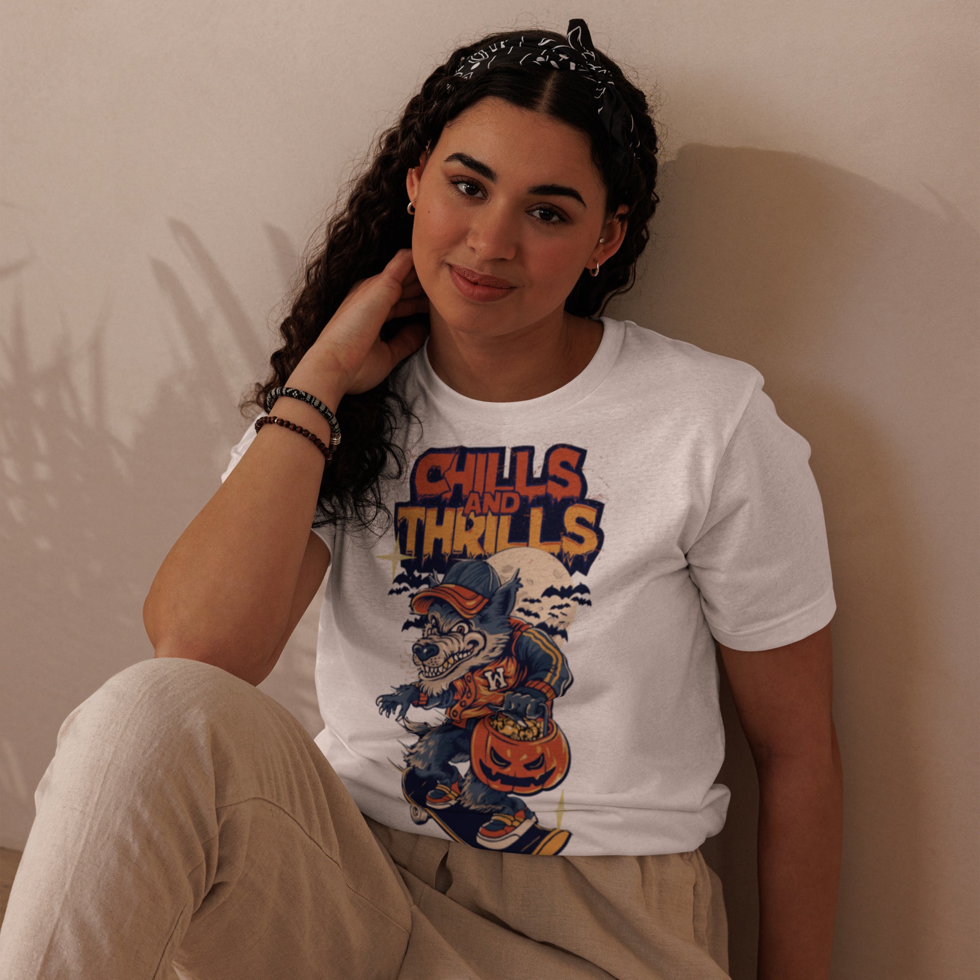 Model wearing a PJ Designs unisex eco friendly t-shirt featuring a fun Halloween graphic