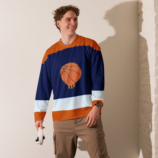 Smiling man wearing PJ Designs unisex hockey streetwear long sleeve shirt with basketball design
