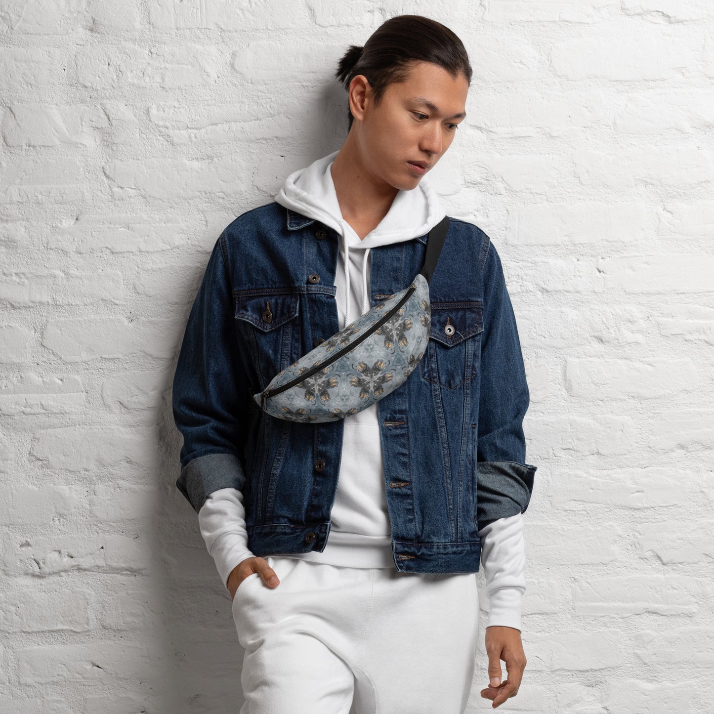 PJ Designs unisex streetwear fanny pack with all over prints worn with denim jacket and white hoodie
