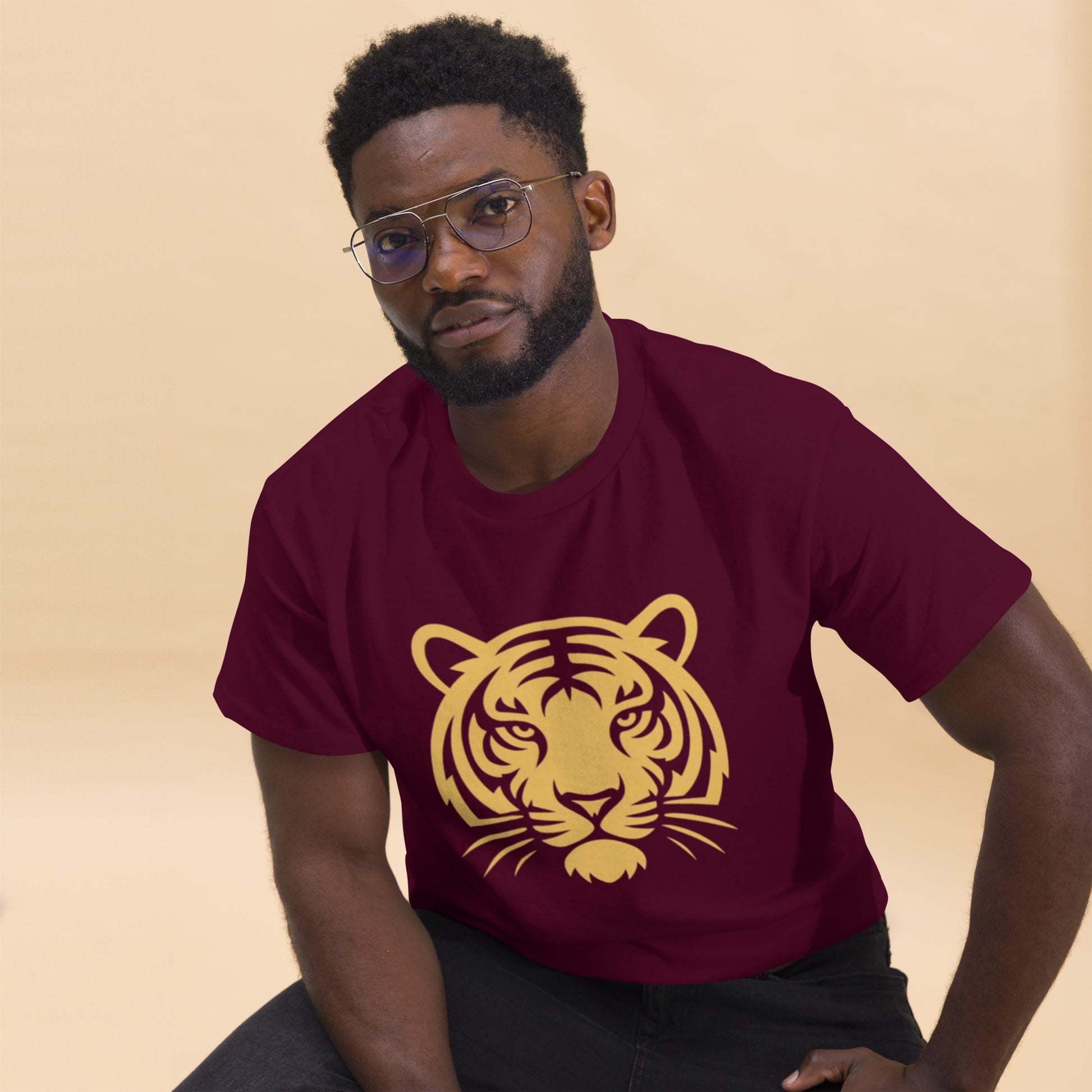 Man wearing PJ Designs maroon shirt with gold tiger face print tiger graphic tee for men and women casual